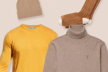 Cashmere sweaters in yellow and beige, pair of gloves, and a winter hat