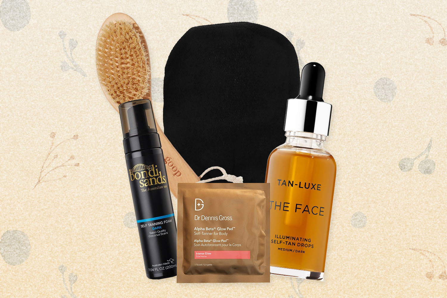 Skin care items: dry brush, self-tanning foam and drops, exfoliator glove