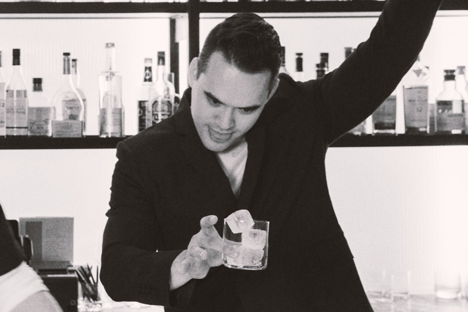 a bartender fixing a drink