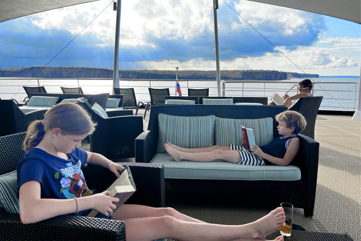 a family reading on a boat