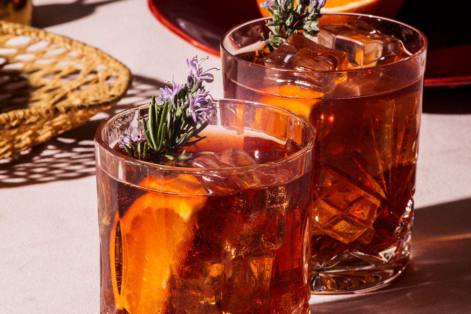 Orange cocktails with rosemary on table