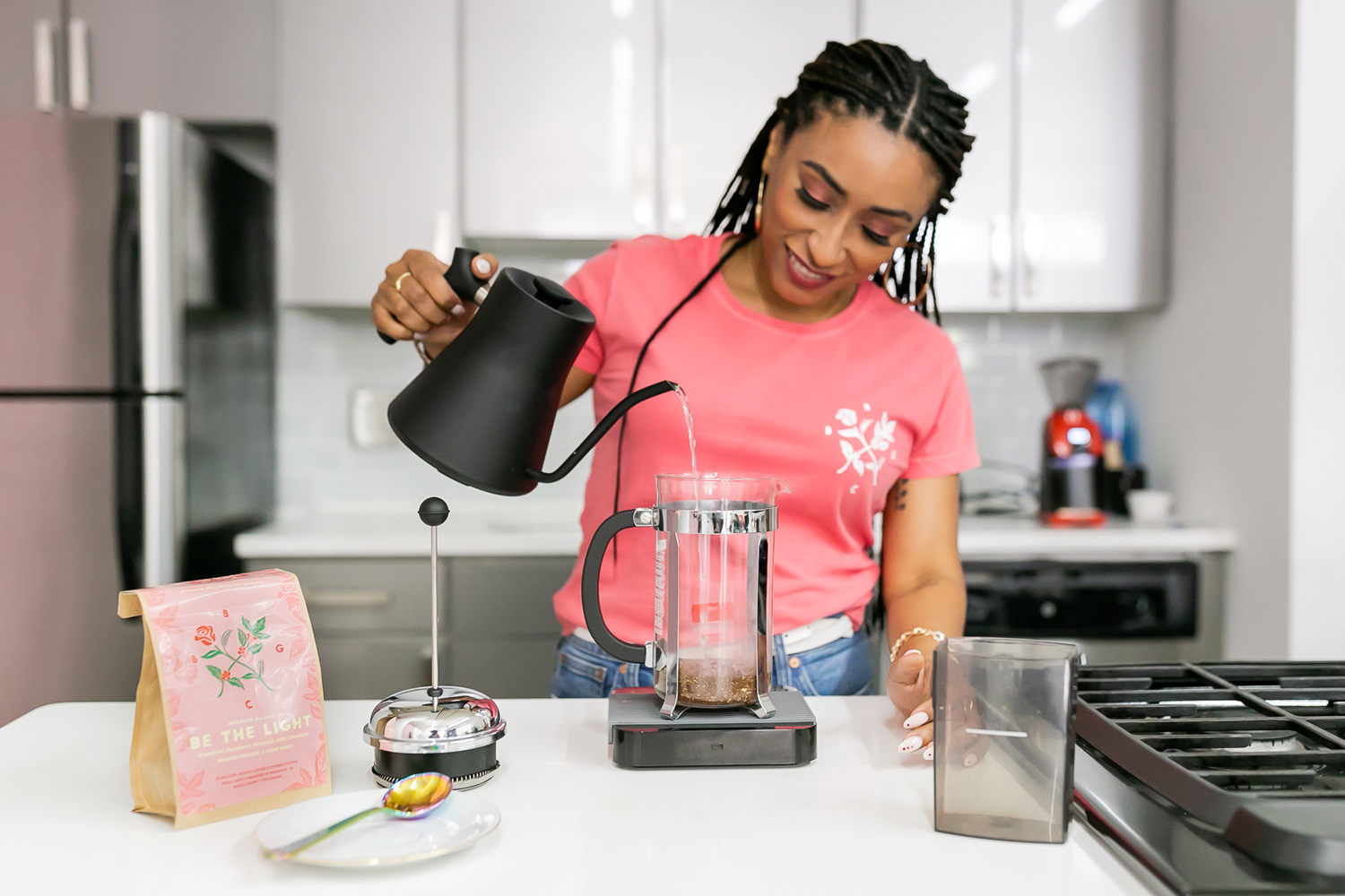 Woman making coffee with French press