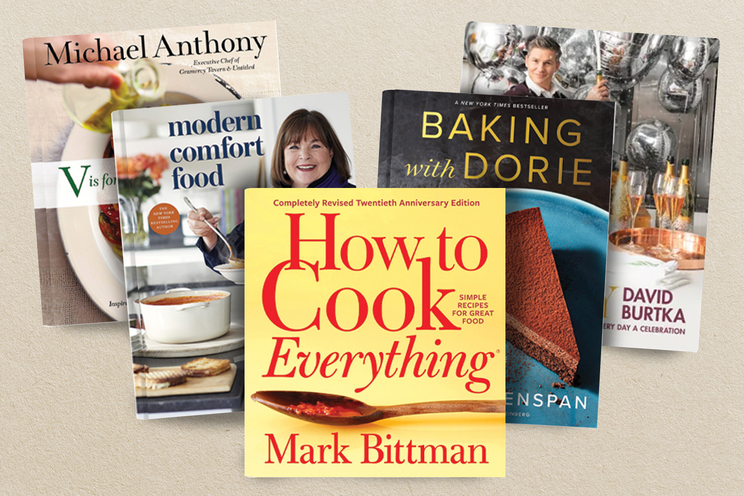 Five cookbooks on beige background