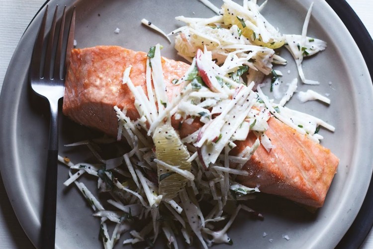 Salmon filet on dish with cole slaw