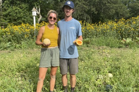 Couple standing in garden field