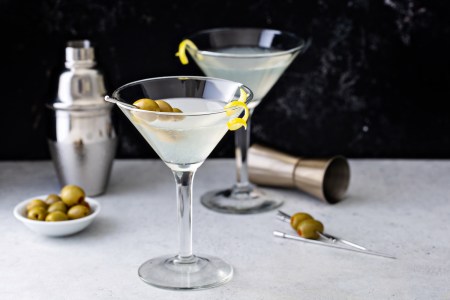 Martini with lemon twist on table