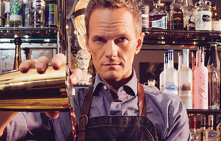 Neil Patrick Harris pouring drinks at a bar
