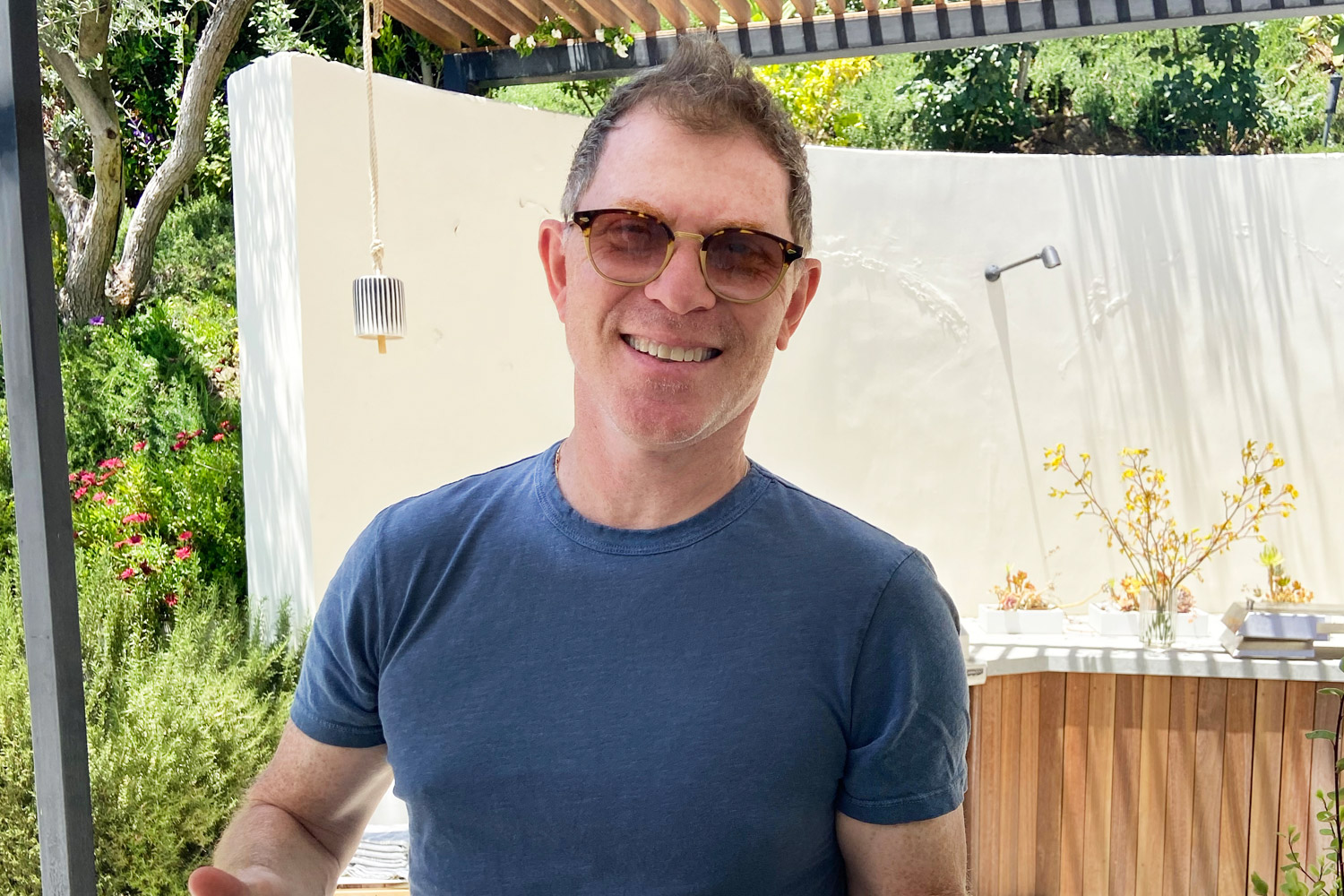 Bobby Flay, grillmaster and all-around good guy, proudly presents his plate of pork.