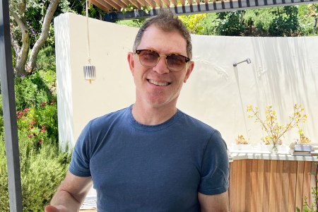 Bobby Flay, grillmaster and all-around good guy, proudly presents his plate of pork. 