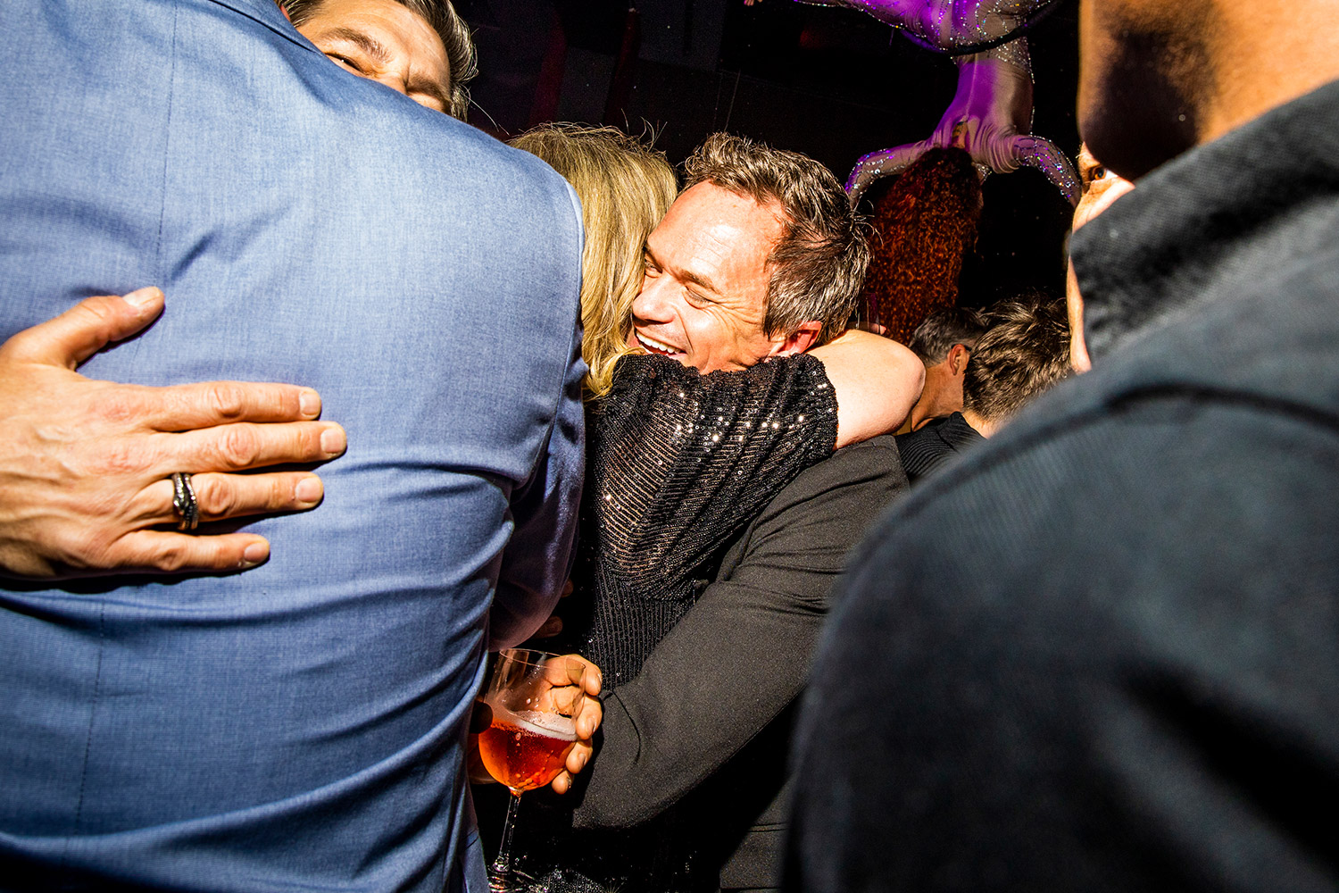 Neil Patrick Harris hugging friends