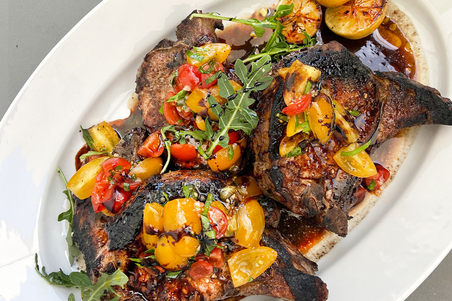 Bobby's grilled pork chops with cherry tomato relish and balasmico.