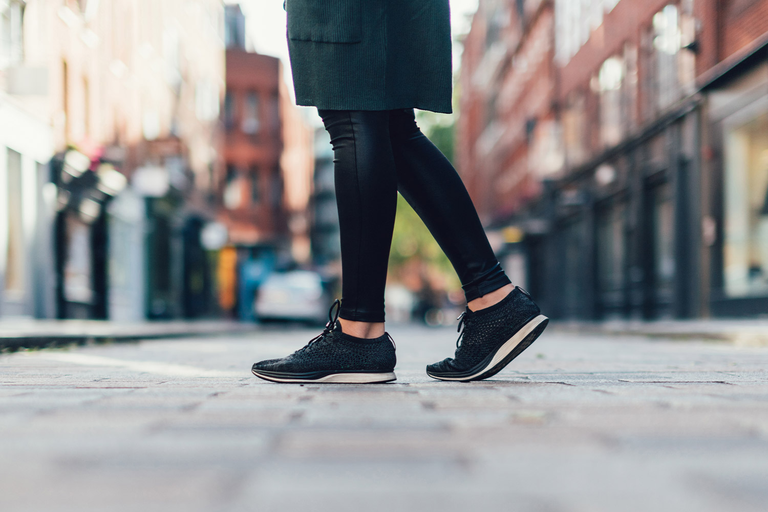 Woman taking a walk on city street in Spring