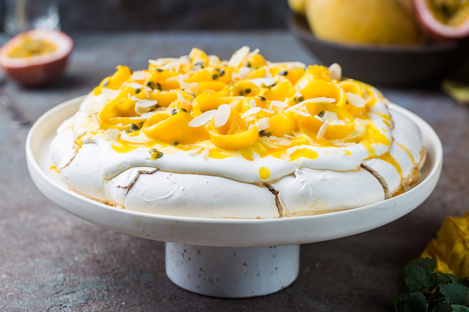 Pineapple passion fruit pavlova dessert on gray table