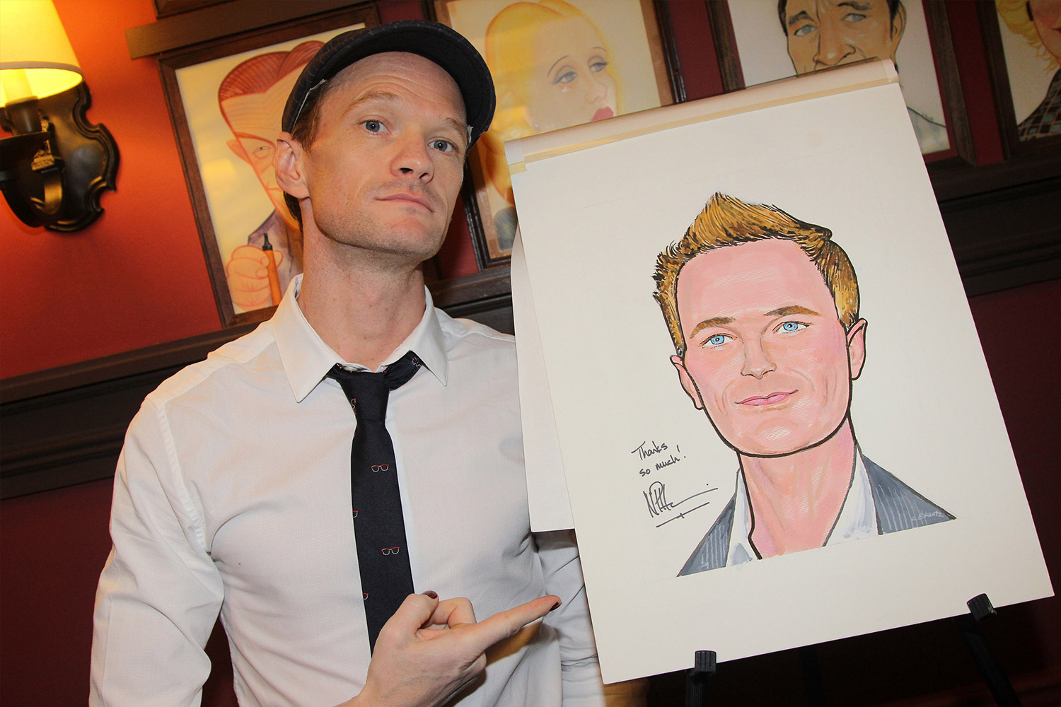 Neil Patrick Harris at Sardi's holding his caricature