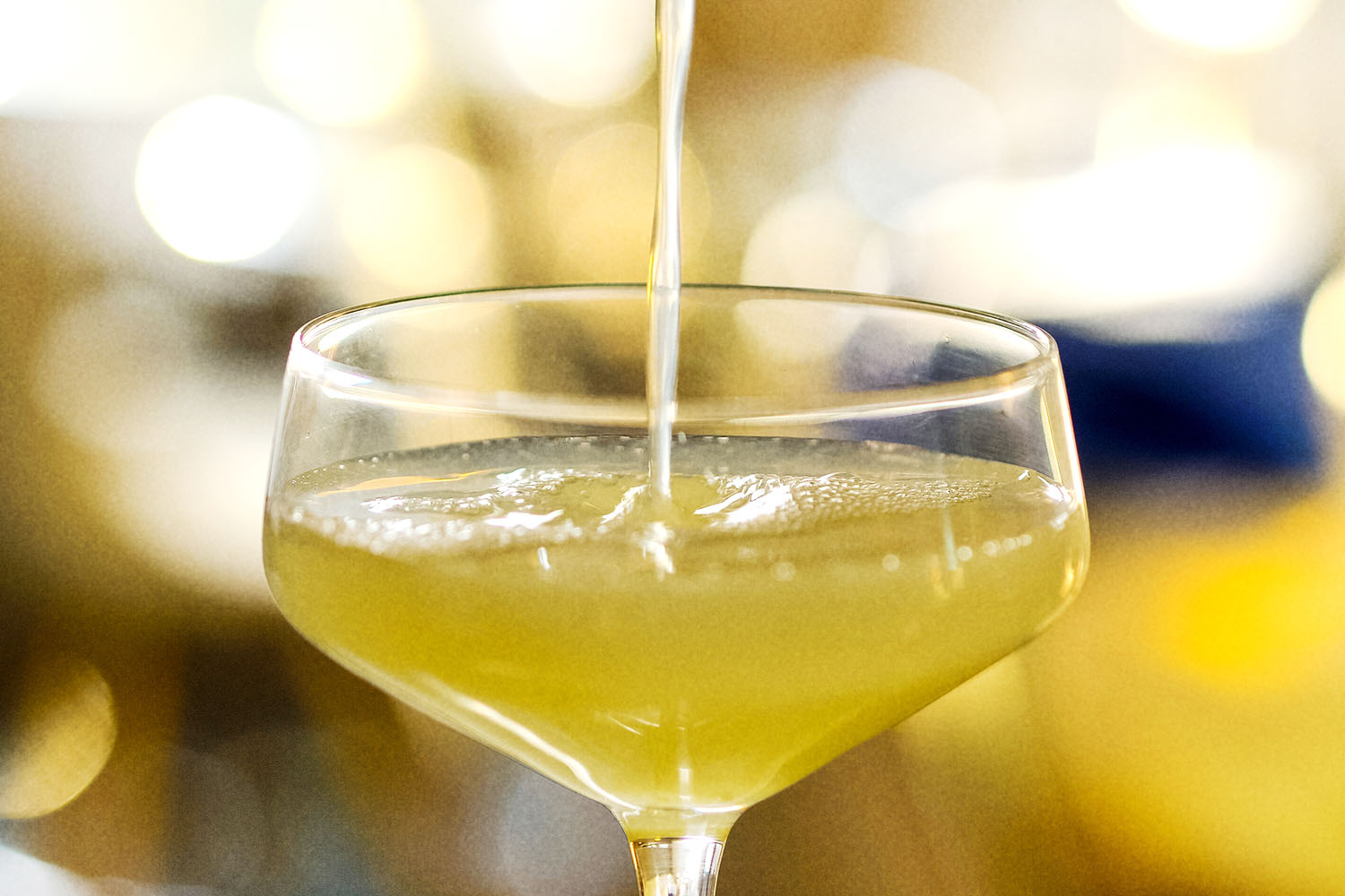 Yellow cocktail in martini glass