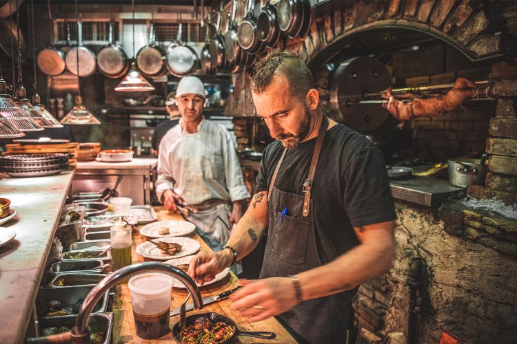 Chef Forge cooking in kitchen