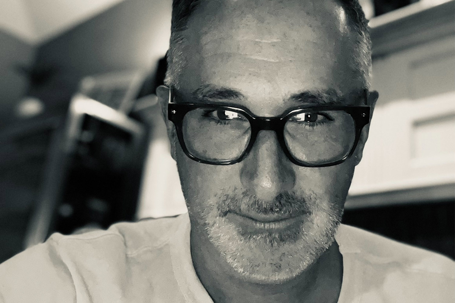 Sepia filtered selfie imaged of Darren Bousman in glasses with a lightly stubbled beard