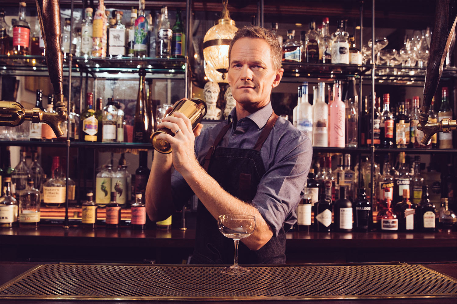 NPH shaking a cocktail 