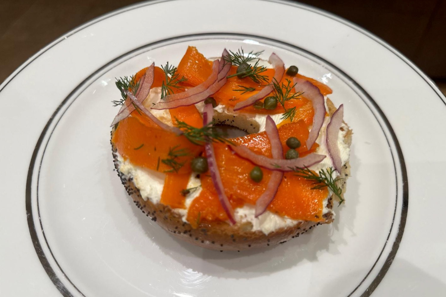 Bagel with vegan cream cheese and vegetables on top