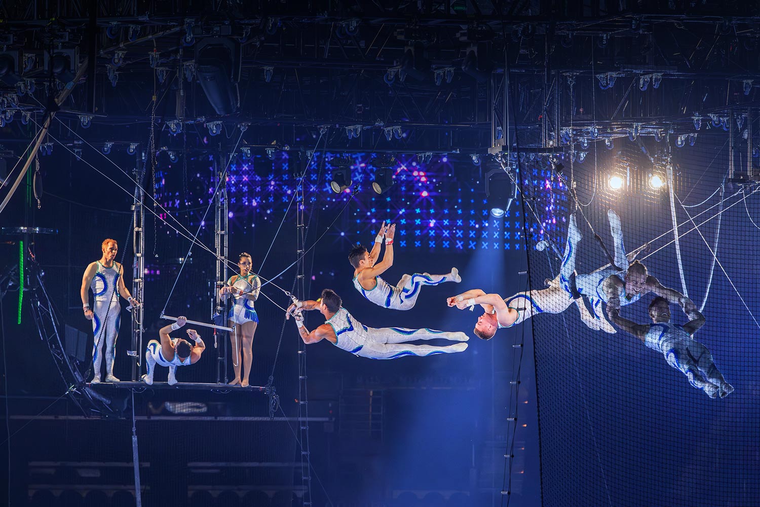 Trapeze artists soaring through the air