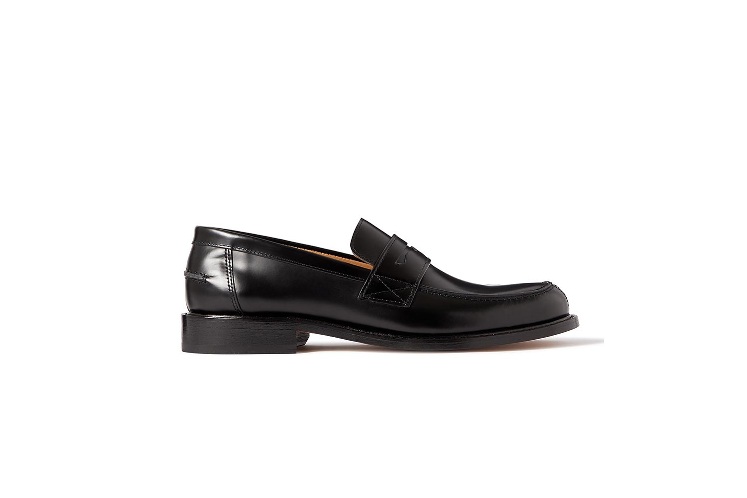 Black leather loafers on a white background
