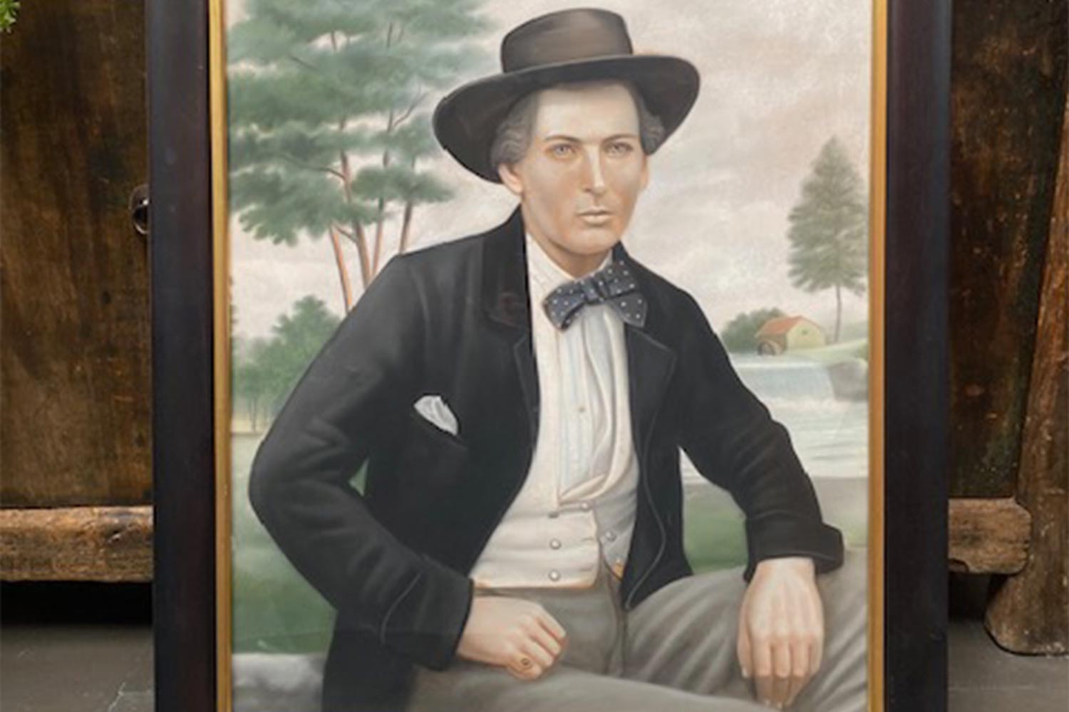 Photograph with an over painting of a man in a top hat