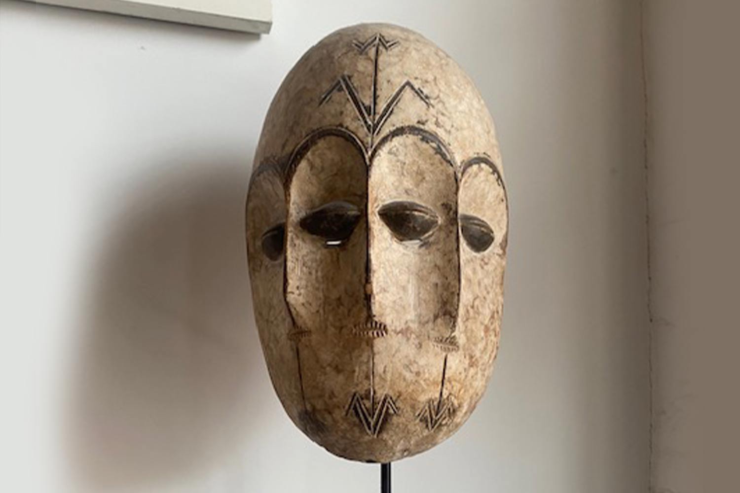 An African mask on a pole